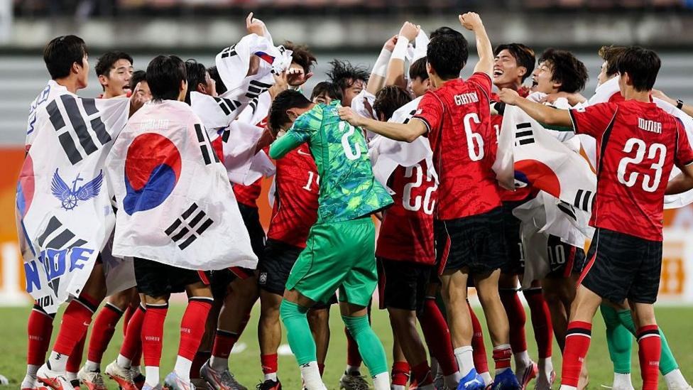 South Korea squad celebrating a victory at the Asian Games
